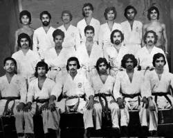 In 1987, from the dojo in Changanacherry, Kerala, India, I am seated first from the left, alongside Instructor Sensei Vam Iqbal, who is seated third from the left. Sensei Iqbal was among my earliest and influential Karate instructors. Sensei Vam Iqbal