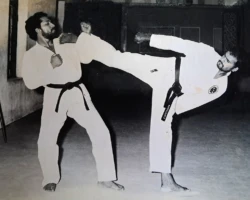 Sensei P. Kuppusamy executing a kick during a Karate session in Cochin, Kerala, India, in 1980 - one of the rare moments I was able to capture a photograph of him in the act of teaching me. kick to Ranjit