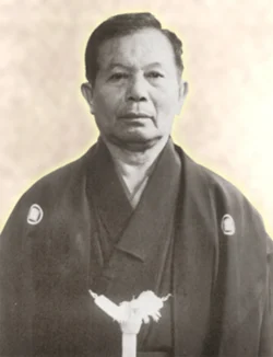 Kanei Uechi (1911–1991) – Son of Kanbun Uechi, he expanded Uechi-Ryu worldwide. Kanei was instrumental and at the forefront of Uechi-Ryū's growth after his father's death and made it accessible to modern students. His fighting stance was extremely strong for defence, and he applied fast wrist blocks with his left arm, and used his right arm for blocking punches and kicks. Kanei Uechi (1911–1991)