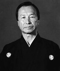Keinosuke Enoeda (1935–2003) – He was a Japanese master of Shotokan karate, nicknamed “Tiger of Shotokan.” His fierce spirit spread Karate across Europe, motivating countless practitioners. He was widely renowned as a formidable karateka. Keinosuke Enoeda (1935–2003)