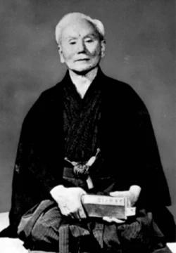Gichin Funakoshi (1868–1957) – Founder of Shotokan, he introduced Karate to mainland Japan in 1922 following its earlier introduction by his teacher Itosu. His philosophy emphasized respect, discipline, and character, transforming Karate into a way of life. He is known as a "father of modern karate". He taught karate at various Japanese universities and became honorary head of the Japan Karate Association upon its establishment in 1949. Gichin Funakoshi (1868–1957)